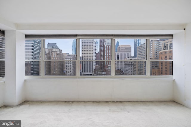 unfurnished sunroom with a view of city