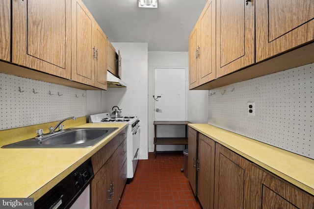 kitchen with under cabinet range hood, white appliances, a sink, light countertops, and decorative backsplash