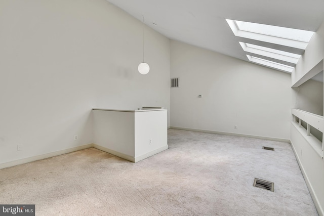 bonus room featuring visible vents, carpet, a skylight, and high vaulted ceiling