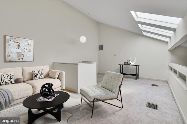 living area with a skylight, baseboards, visible vents, and carpet floors