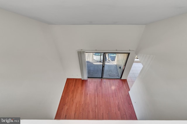 spare room featuring wood finished floors