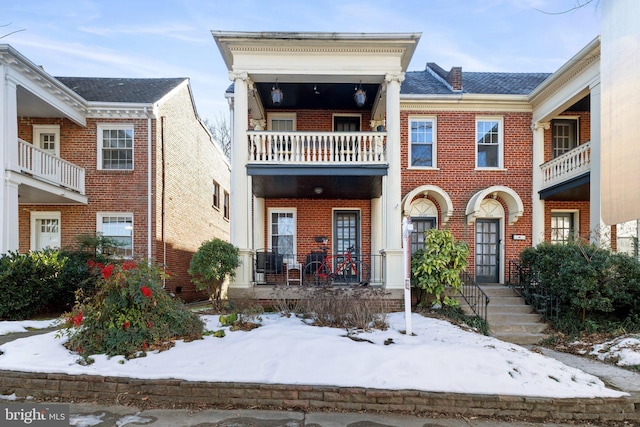 view of front of property featuring brick siding