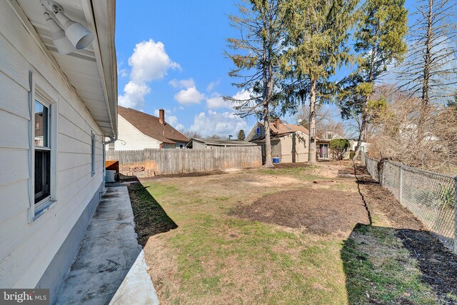 view of yard with a fenced backyard