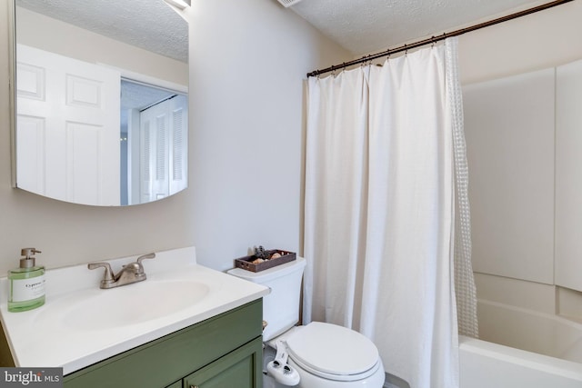 full bathroom with a textured ceiling, shower / bath combination with curtain, vanity, and toilet