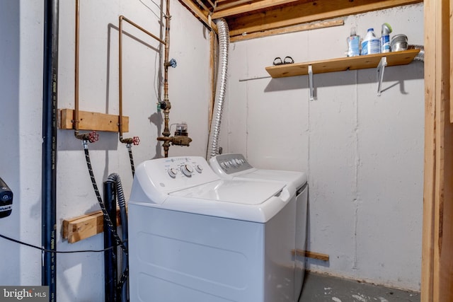 laundry area featuring laundry area and washer and clothes dryer