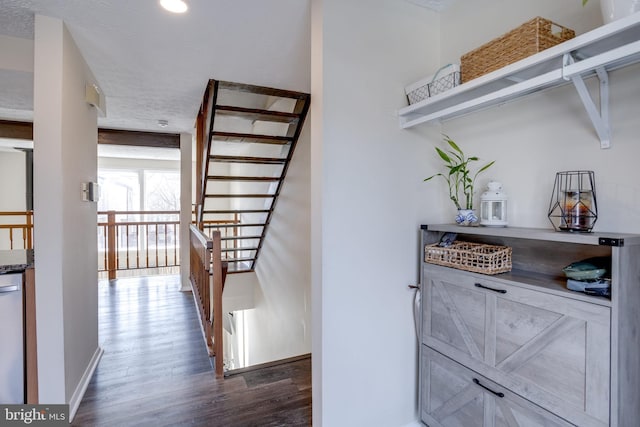 stairs featuring recessed lighting, baseboards, a textured ceiling, and wood finished floors