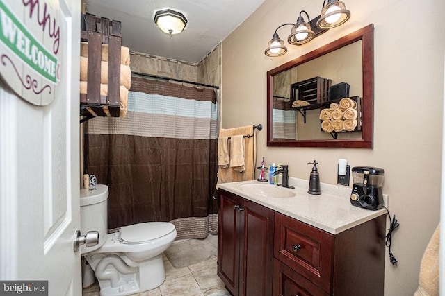 bathroom featuring toilet, vanity, tile patterned flooring, and a shower with curtain