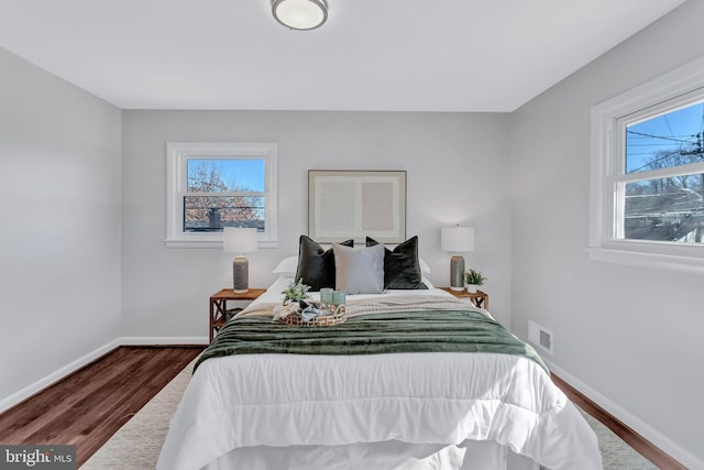 bedroom featuring dark hardwood / wood-style flooring