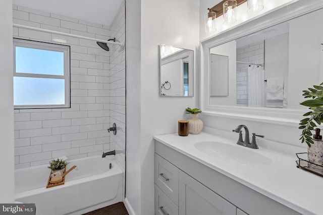 bathroom with shower / bath combination with curtain and vanity