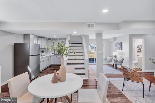 dining room with hardwood / wood-style floors