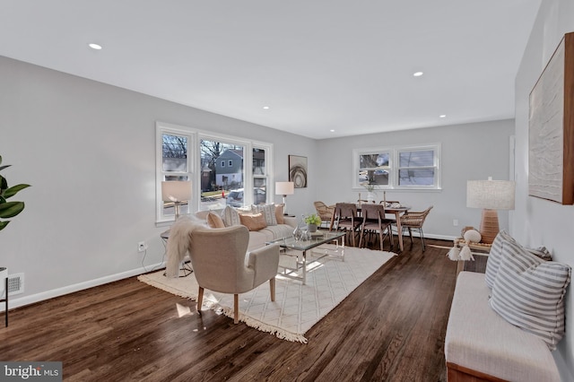 living room featuring dark wood-type flooring