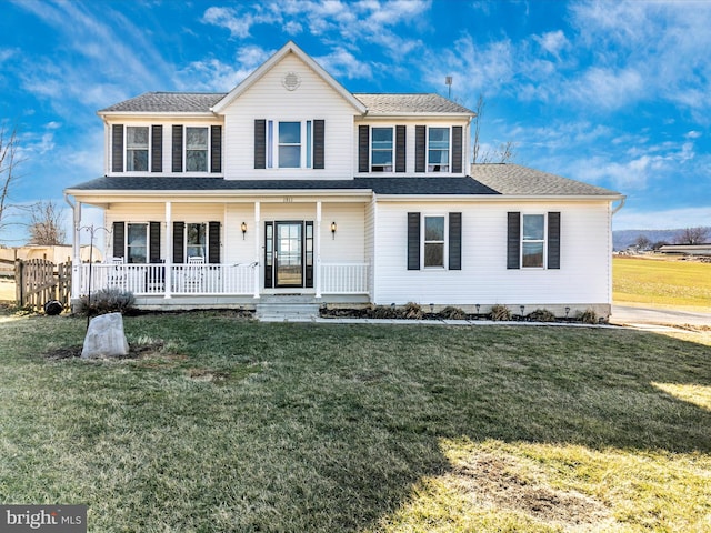 view of front of home featuring crawl space, covered porch, roof with shingles, and a front lawn