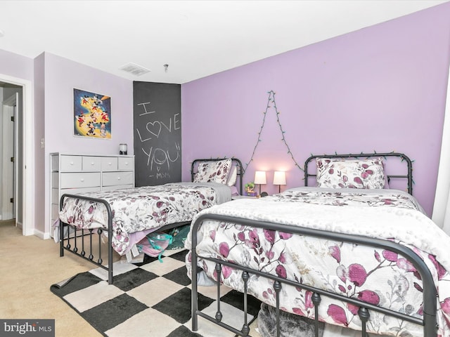 bedroom with carpet floors, visible vents, and baseboards