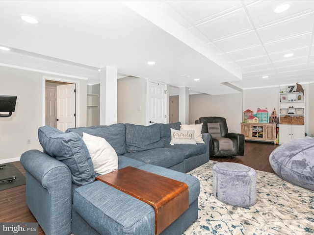 living room featuring dark wood-style flooring, recessed lighting, built in features, and baseboards