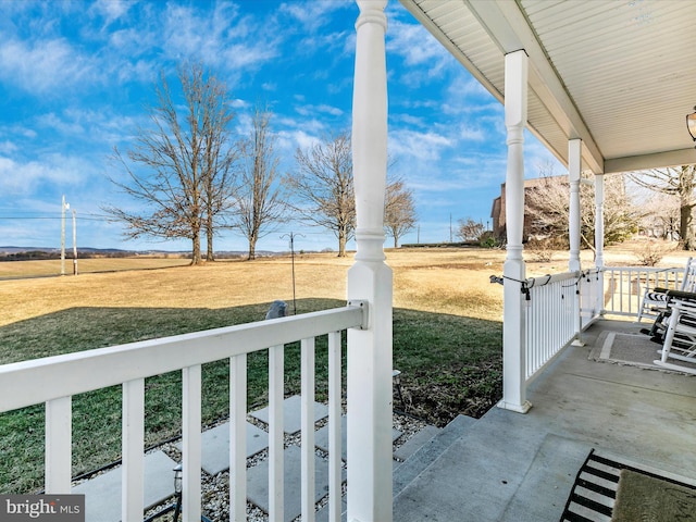 view of yard with covered porch