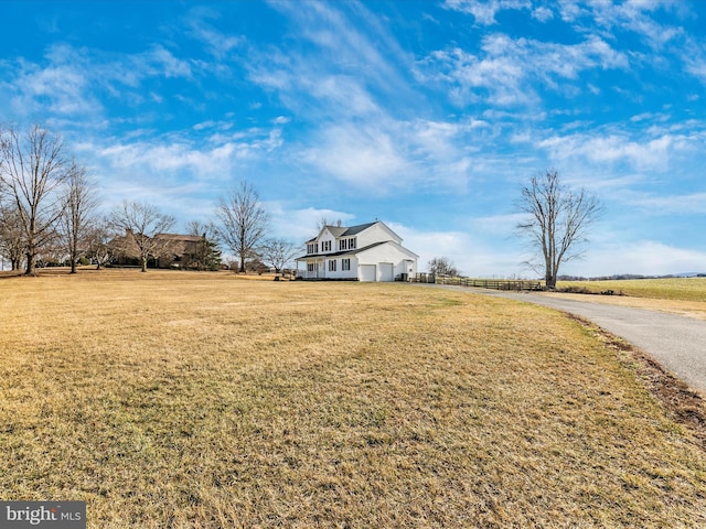 view of yard with a rural view