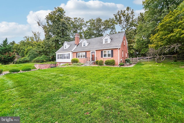 new england style home featuring a front yard