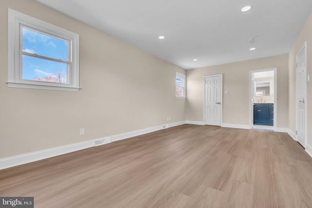 interior space featuring visible vents, recessed lighting, light wood-style flooring, and baseboards