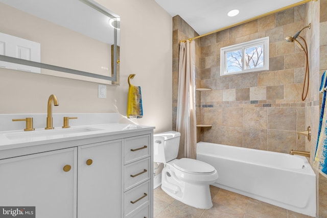 bathroom featuring toilet, shower / tub combo, tile patterned floors, and vanity