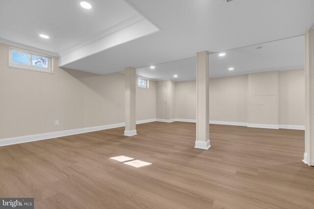 basement with light wood-style floors, baseboards, and recessed lighting