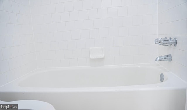 bathroom featuring a washtub