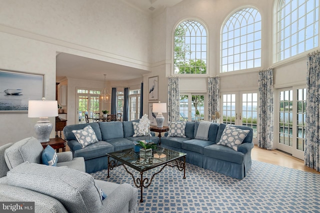 1556 Widows Mite Rd, Edgewater, MD 21037 - living area featuring a high ceiling, plenty of natural light, french doors, and wood finished floors
