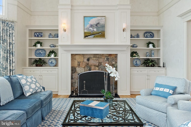 1556 Widows Mite Rd, Edgewater, MD 21037 - living room with a fireplace with flush hearth, light wood finished floors, and built in features