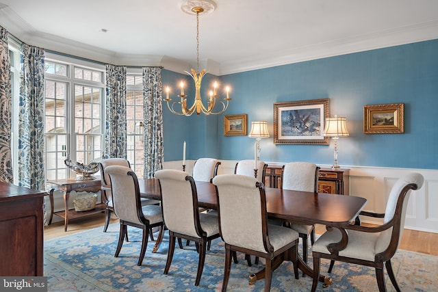 1556 Widows Mite Rd, Edgewater, MD 21037 - dining area with ornamental molding, a chandelier, wood finished floors, and a wainscoted wall