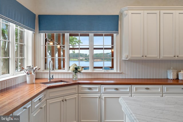 1556 Widows Mite Rd, Edgewater, MD 21037 - kitchen featuring wood counters, white cabinets, and a water view
