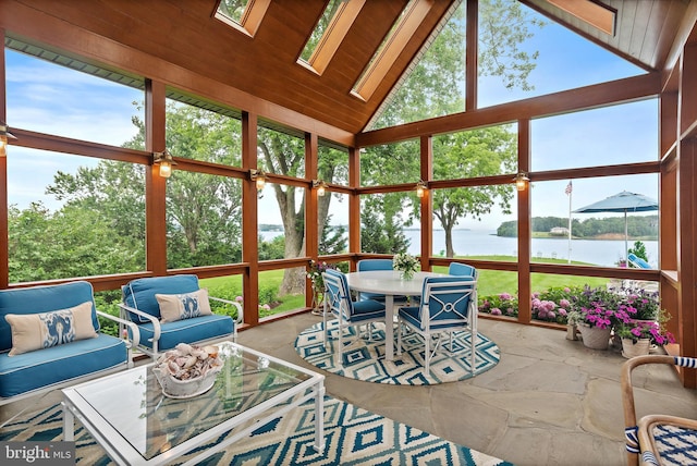 1556 Widows Mite Rd, Edgewater, MD 21037 - sunroom featuring a water view, outdoor dining area, a skylight, outdoor lounge area, and vaulted ceiling