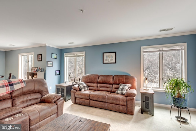 living area with ornamental molding, visible vents, and light carpet