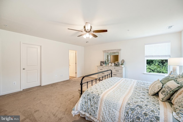 bedroom with ceiling fan, carpet, visible vents, and baseboards