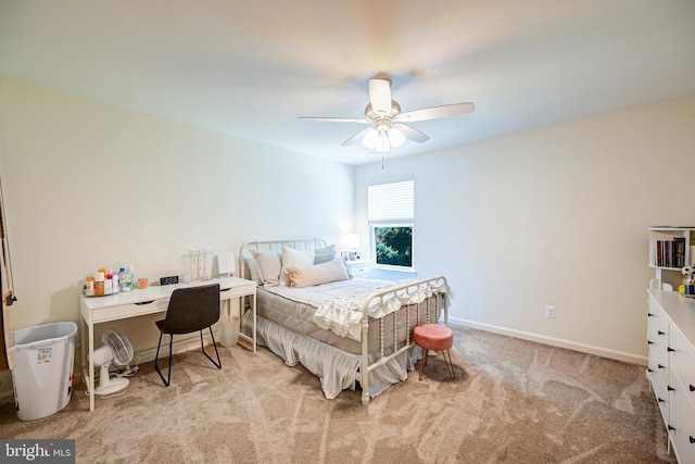 bedroom featuring light carpet, ceiling fan, and baseboards