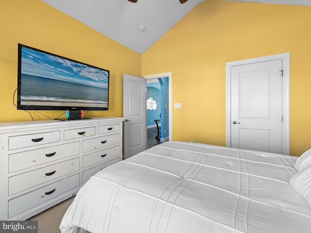 bedroom with lofted ceiling and ceiling fan