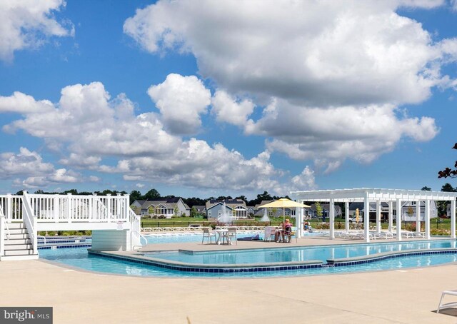 32241 Ivory Gull Way, Millsboro, DE 19966 - community pool featuring a pergola