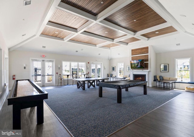 32241 Ivory Gull Way, Millsboro, DE 19966 - game room with french doors, coffered ceiling, wood finished floors, beamed ceiling, and a warm lit fireplace