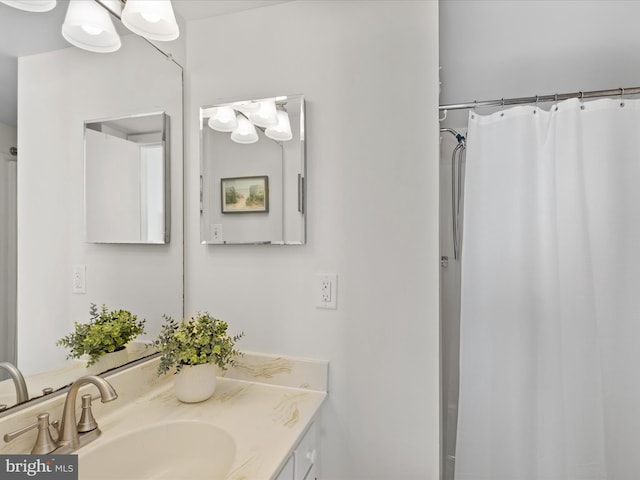 bathroom with a shower with curtain and vanity