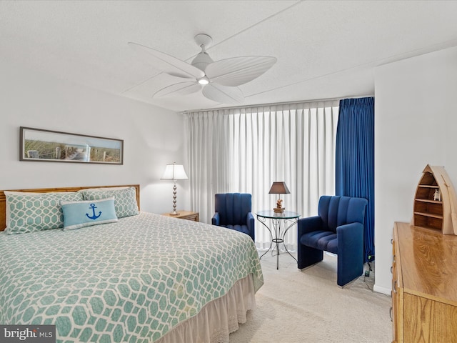 bedroom with ceiling fan and carpet