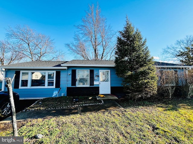 ranch-style house with a front lawn