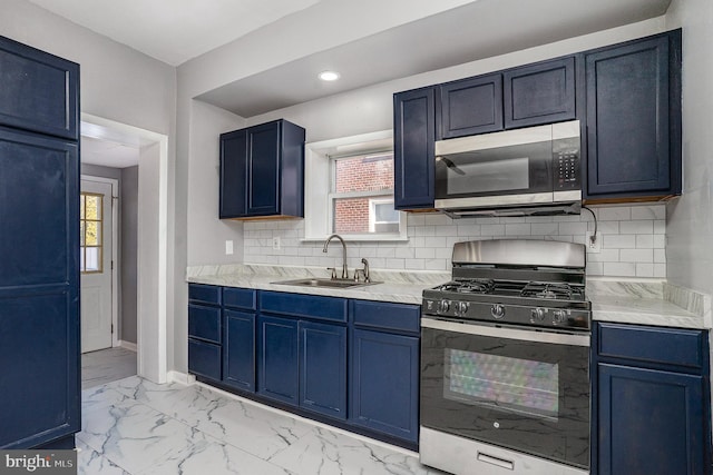 kitchen featuring black gas stove, a sink, stainless steel microwave, blue cabinets, and marble finish floor