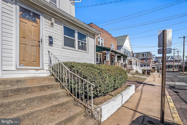 property entrance featuring a residential view