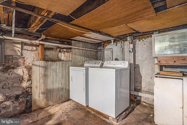 unfinished basement featuring washer and dryer