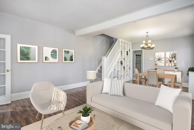 living room featuring baseboards, dark wood finished floors, beam ceiling, an inviting chandelier, and stairs