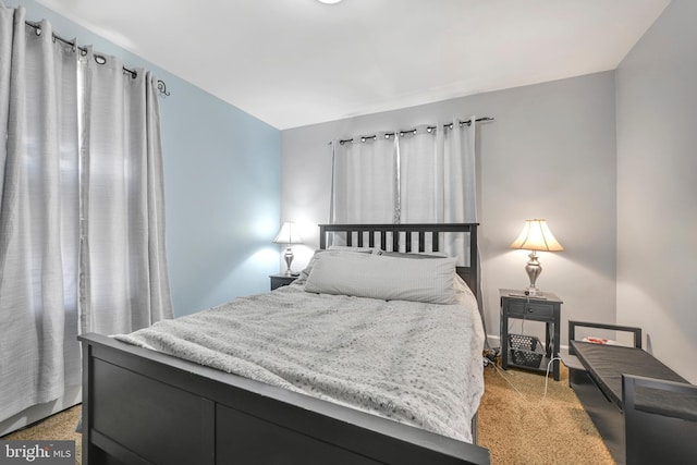 bedroom with light colored carpet