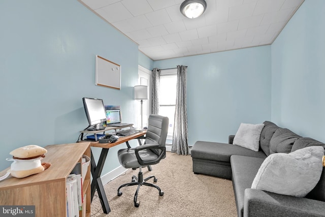 carpeted office with baseboards