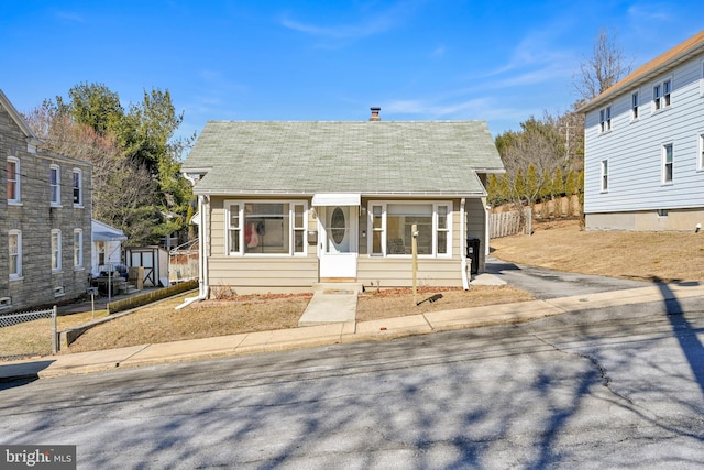 view of front of home with fence