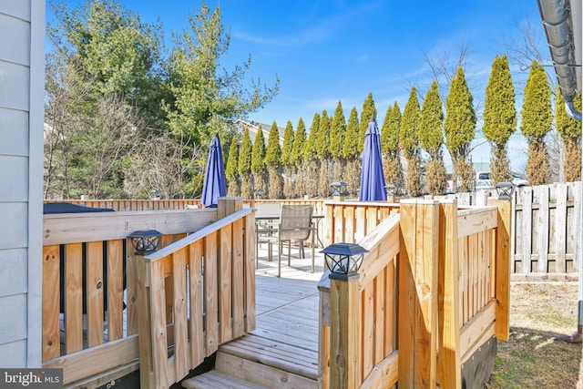 wooden deck with outdoor dining area