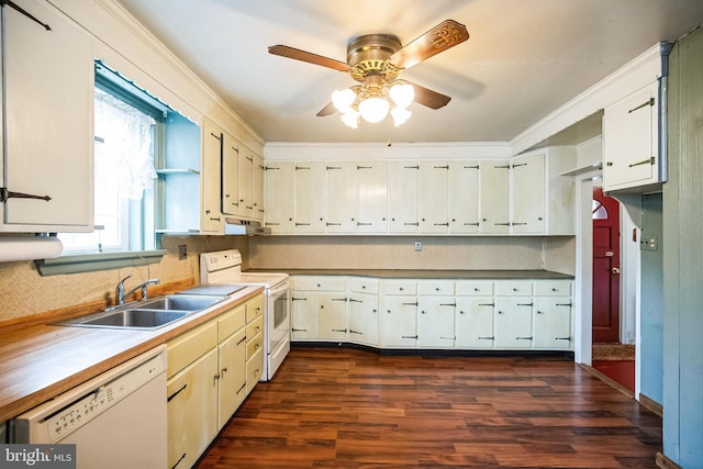 kitchen with white appliances, white cabinets, decorative backsplash, dark wood finished floors, and a sink