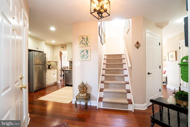 stairway featuring hardwood / wood-style floors