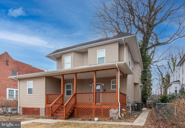 view of front of house with covered porch and central AC unit